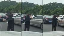 Traffic woes? Watch Chinese woman practice Tai Chi during a jam