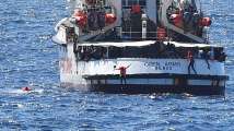 Tensions build on migrant ship off Italy; 10 jump overboard