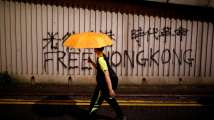 Hong Kong leader focuses on housing as protesters head for the hills