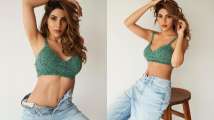 Nikki Tamboli poses in unbuttoned pants and green crop top, drops sizz...