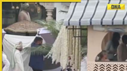 Watch viral video: Parineeti Chopra, Raghav Chadha use giant umbrellas to hide wedding look from paps